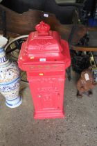 A large red painted post box