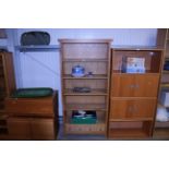 A modern oak open fronted bookcase with adjustable