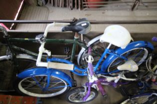 A lady's Beach Cruiser bicycle with front and rear