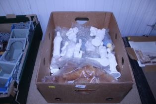 A box of Latex Nativity moulds and ready cast nati