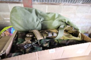 A quantity of camouflage Army clothing, waistcoats