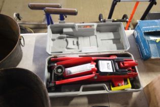 A two ton hydraulic car jack in plastic carry case