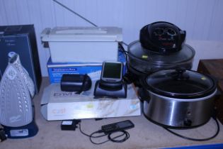 A slow cooker; a steam cooker; a paper shredder an