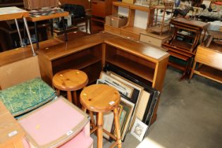 An L shaped opened fronted bookcase