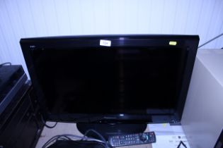 A Panasonic flat screen television with remote con