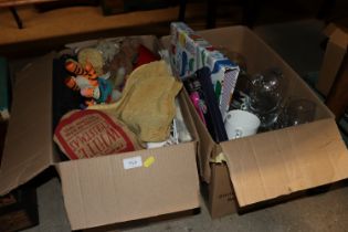 Two boxes containing various soft toys and glasswa