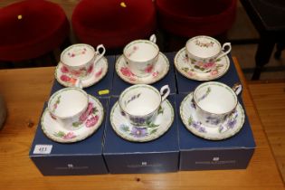 Six boxed Royal Kendall cups and saucers decorated