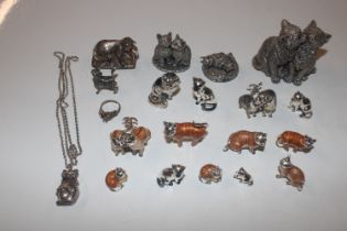 A collection of silver and enamel cat ornaments an