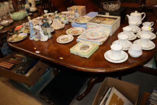 A walnut twin pedestal dining table with two extra