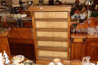 An oak open fronted bookcase