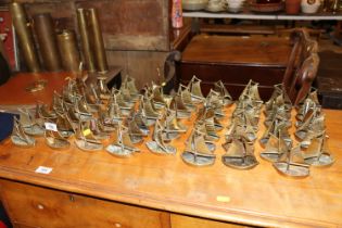 A collection of brass sailing boat ornaments