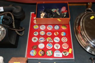 Ten John Bull tyre keyrings and others, Jaguar badge, Lucas tractor key; and a tray of petrol