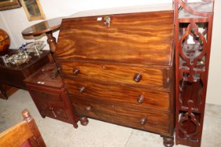 A Victorian mahogany bureau fitted three drawers