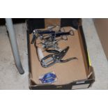 A box of various corkscrews