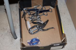 A box of various corkscrews