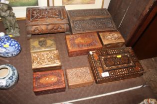 A carved wooden box and contents of various costum