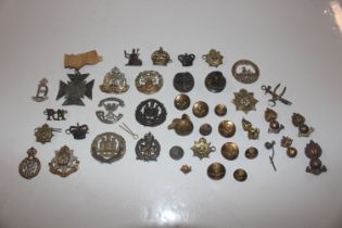 A bag of mixed military badges