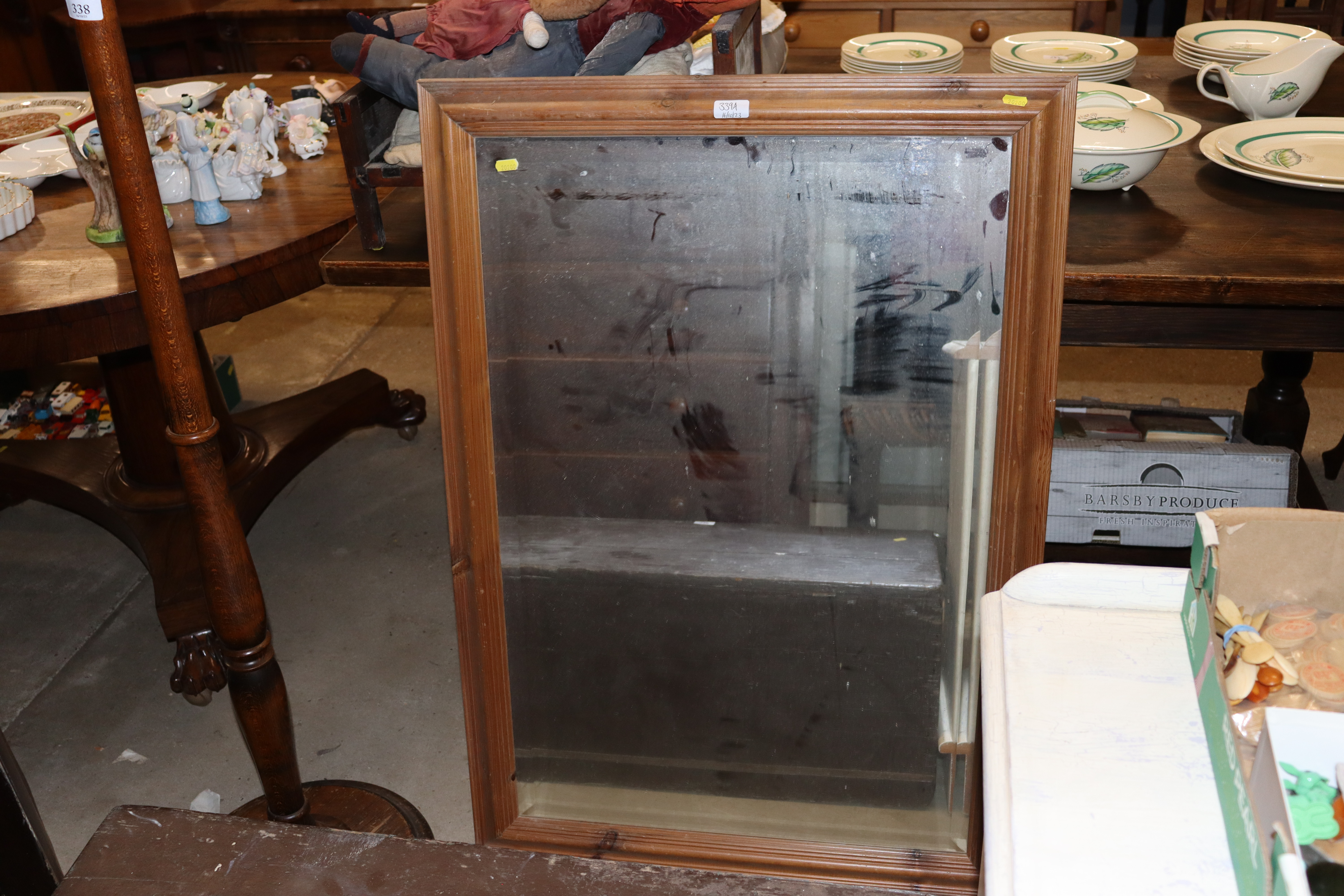 A large pine framed bevel edged wall mirror