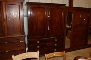 A Georgian mahogany linen press converted to a han