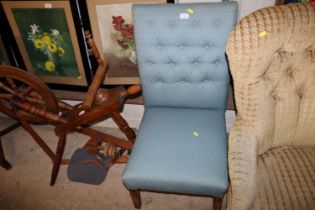 A blue upholstered nursing chair