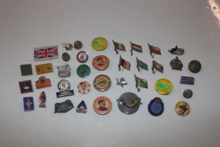 A bag of mixed badges and buttons etc.