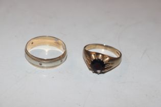 A 9ct gold ring set with garnet coloured stone, ri