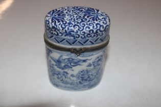 A Limoges blue and white porcelain box and cover