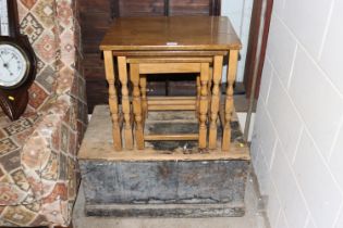 A nest of three oak occasional tables; and a pine