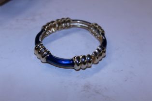 A Donald Stannard bracelet, gold tone and blue enamel