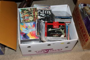 A box of various CD's