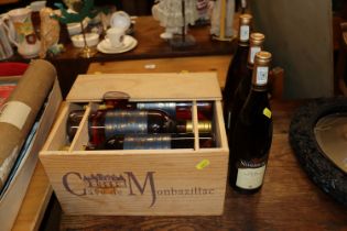 A crate of six bottles of Monbazillac wine and thr