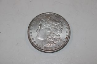 An 1879 silver Morgan dollar