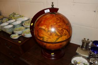 A table top globe drinks cabinet