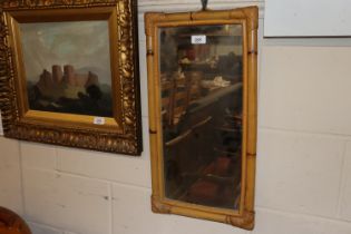 A cane framed oblong wall mirror