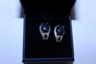 A boxed pair of silver and amber ear-rings