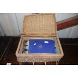 A wicker basket containing Norfolk Regiment book a