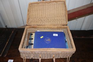 A wicker basket containing Norfolk Regiment book a