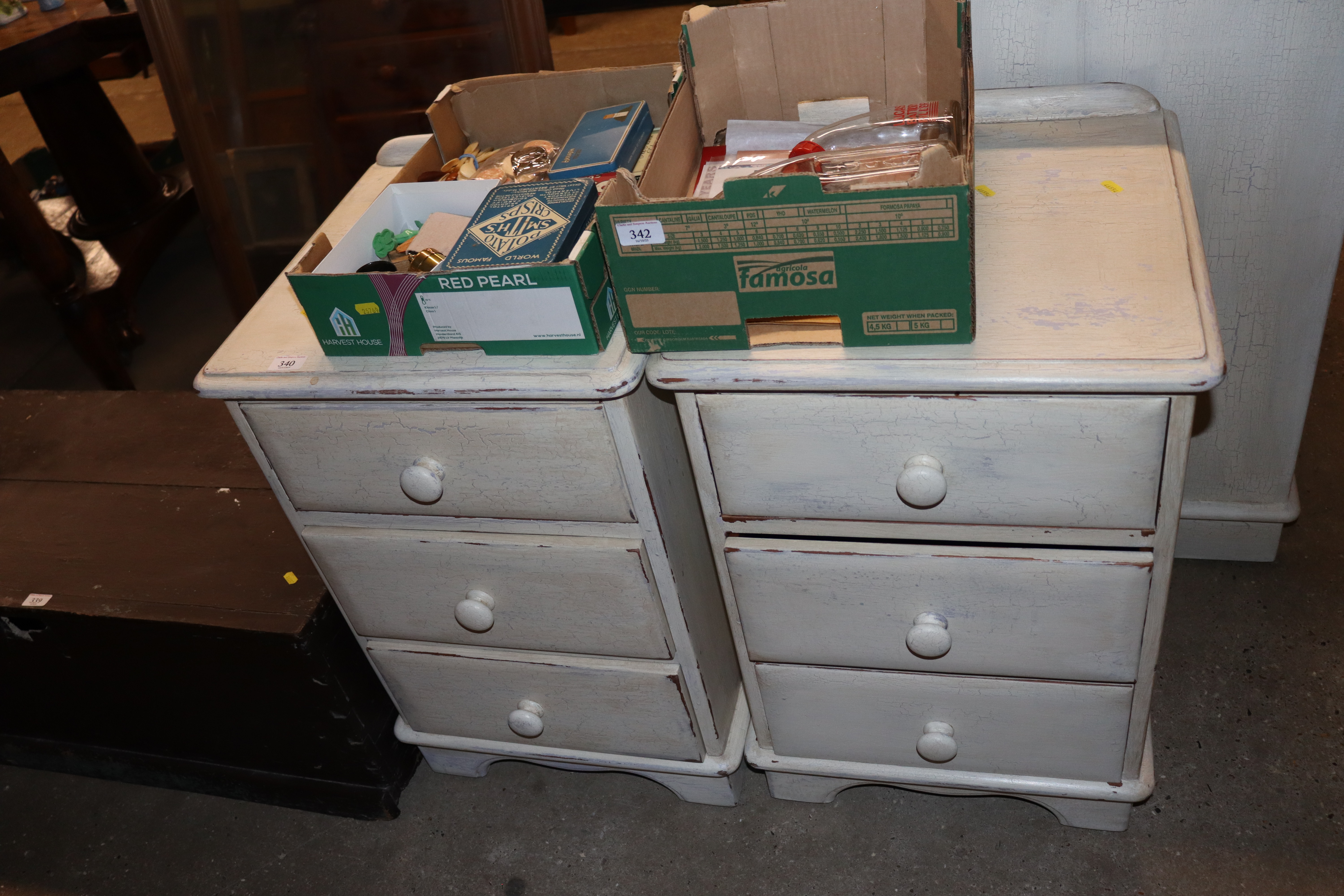 A pair of Lovelace painted pine three drawer bedsi