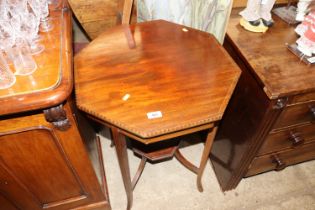 An Edwardian mahogany octagonal topped occasional