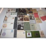 A collection of assorted ephemera, photos, stamp s