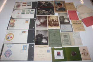 A collection of assorted ephemera, photos, stamp s