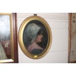 An oval gilt framed oil, portrait study of lady wi