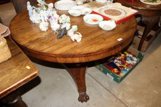 A Victorian rosewood tilt top supper table raised