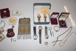 A box of various jewellery, wrist watches, evening