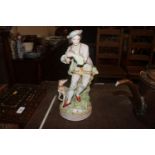A porcelain figure with attendant dog, initialled