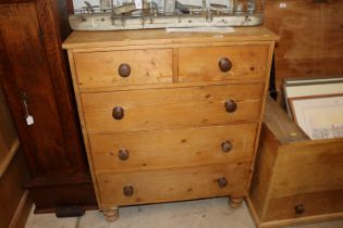 A stripped pine chest fitted two short over three