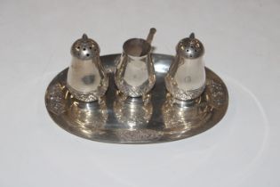 A Thai Sterling three piece cruet on tray, approx.