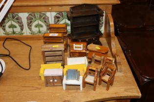 A quantity of hand made wooden doll's house furnit
