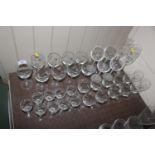 A collection of etched and other drinking glasses,