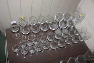 A collection of etched and other drinking glasses,